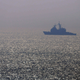 A US warship cruises through the Gulf of Oman.